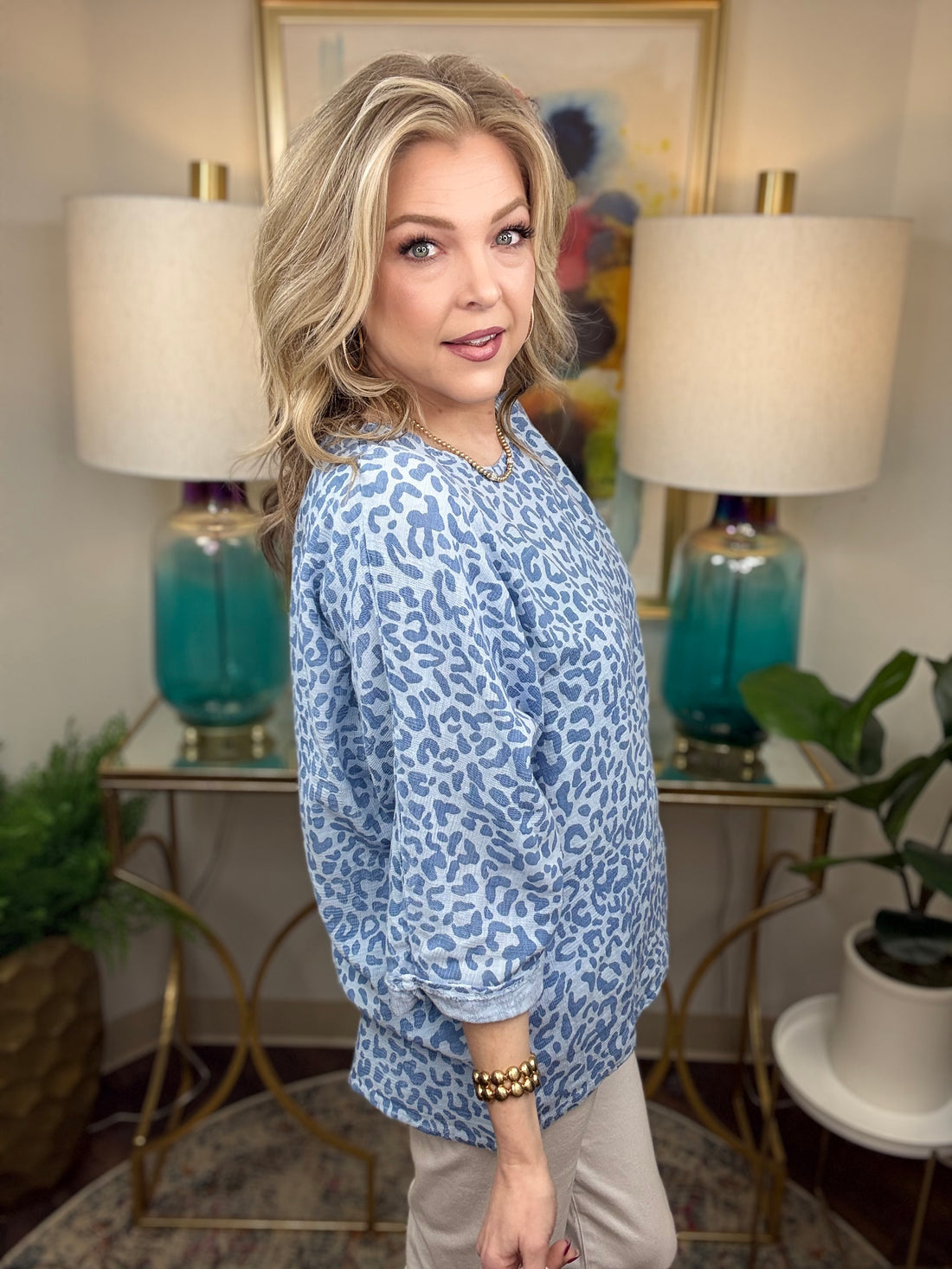 Woman wearing a blue leopard print top