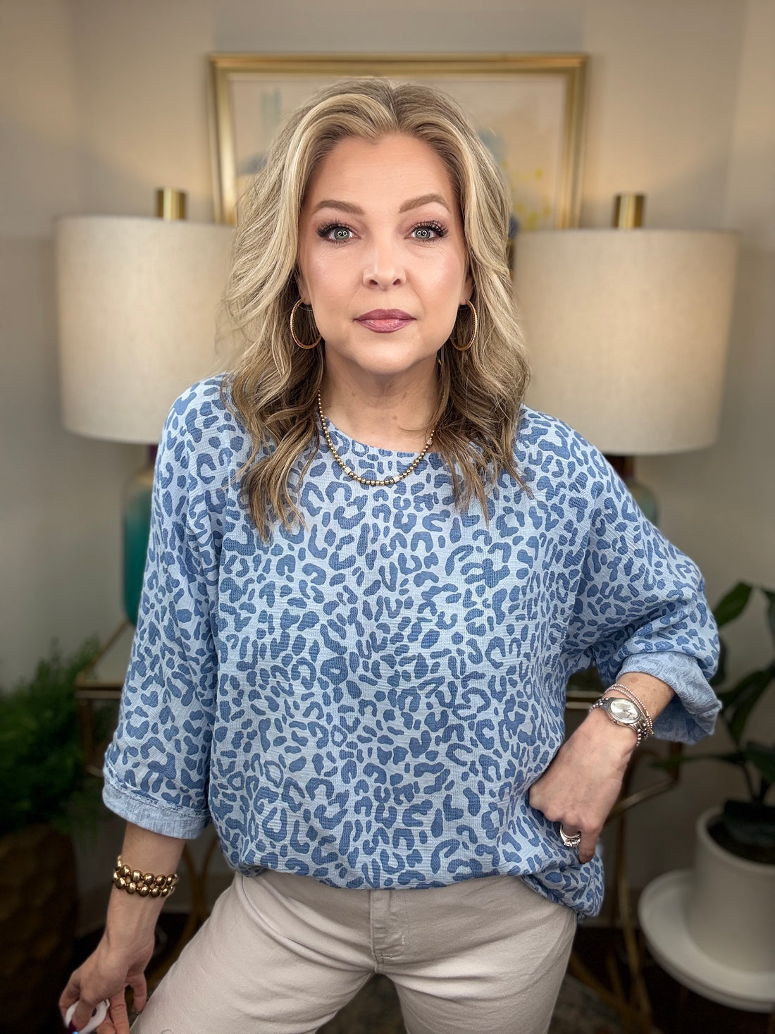 Woman wearing a blue leopard print top