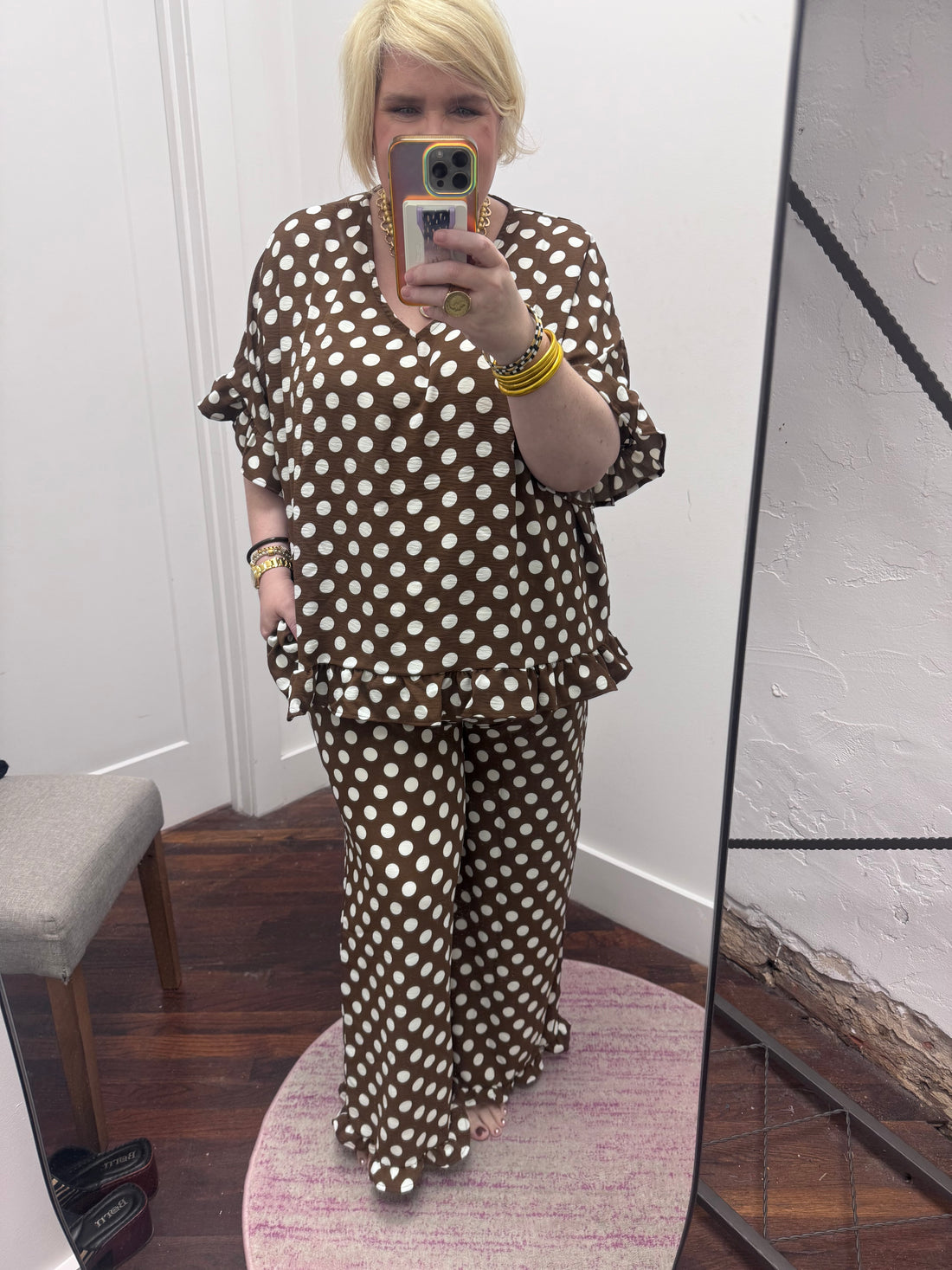 matching brown and white polka dot lounge set, featuring a short-sleeve V-neck top and wide-leg pants with ruffle hems
