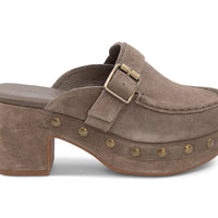 The Genni platform mule boasts a suede upper accented with aged-finish hardware and a loafer-inspired topline distinguish a retro suede mule
