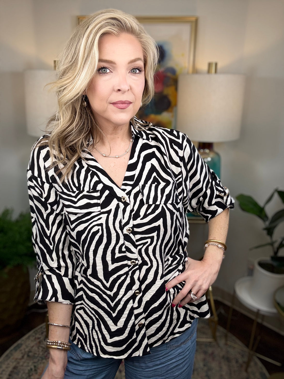 Women’s zebra print blouse with classic button-up design