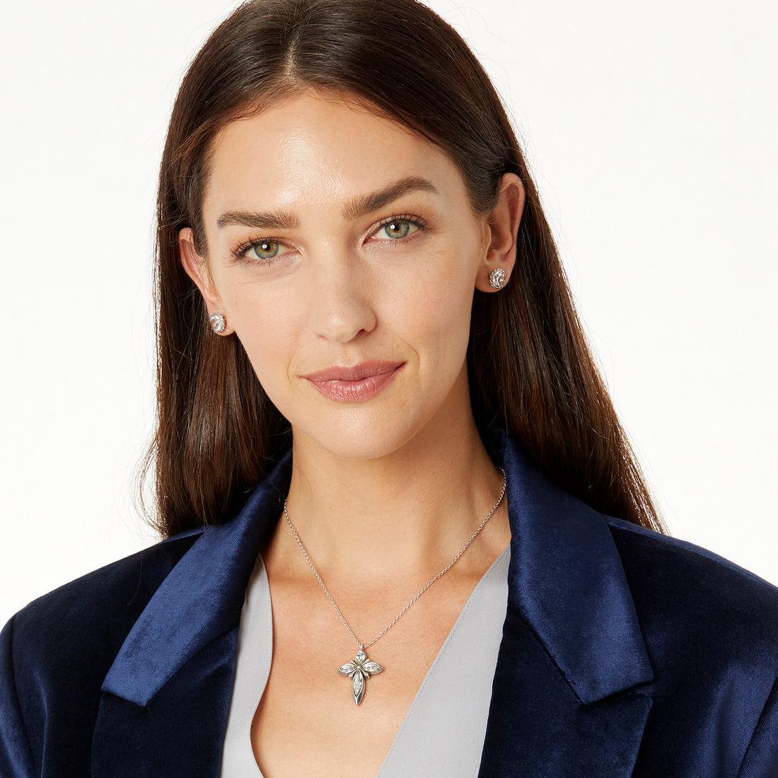 Woman wearing a necklace and earrings on a white background