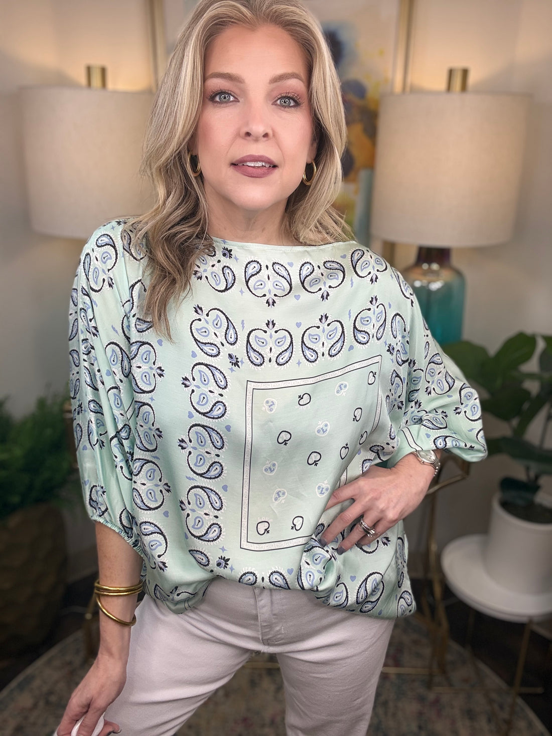 Woman wearing a mint bandana style top