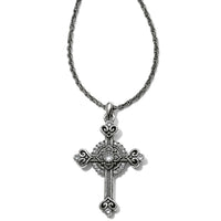 Silver cross pendant necklace on a white background