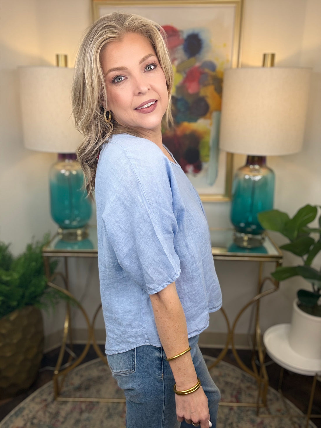 Woman wearing blue linen top