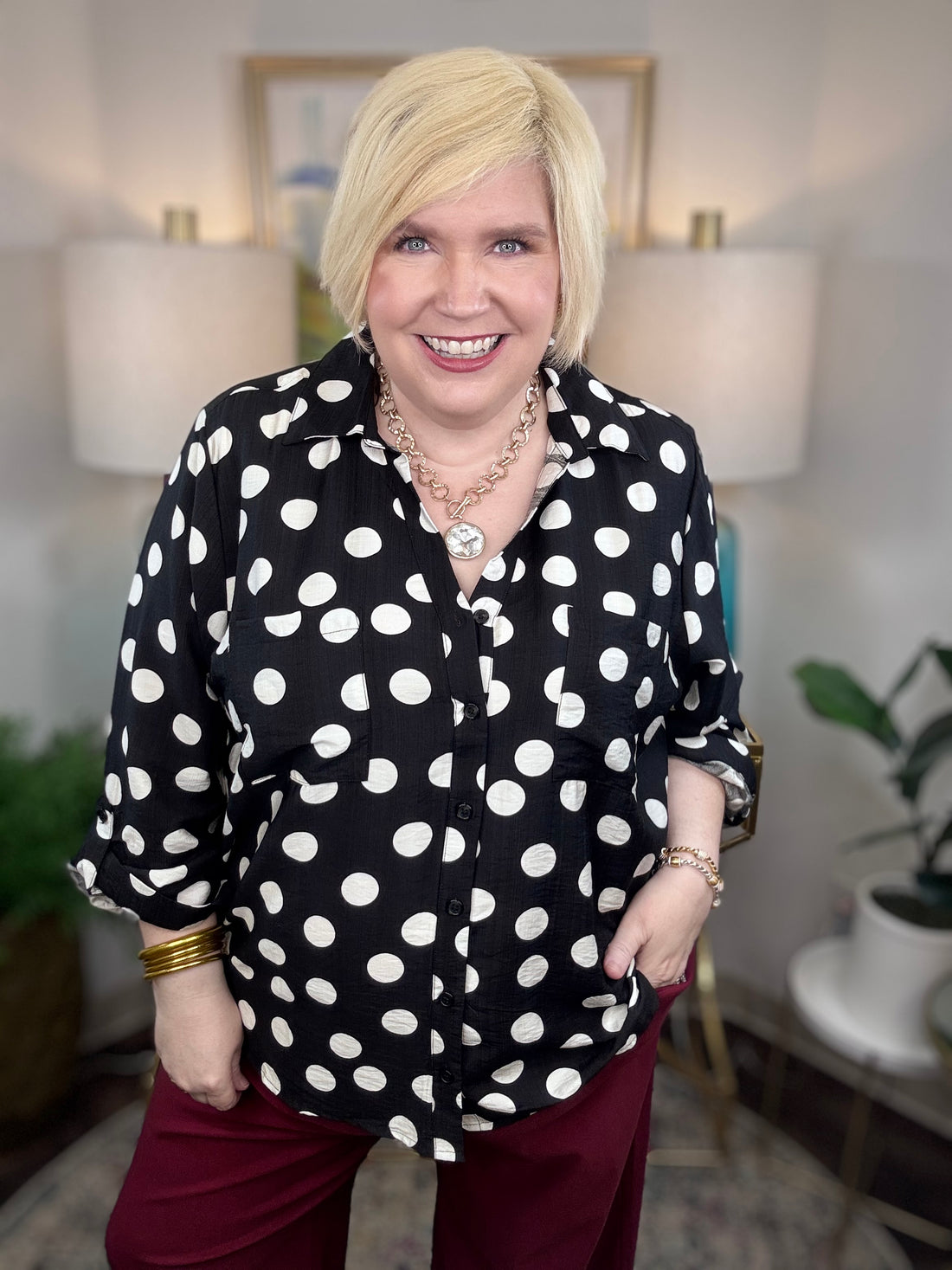 Black button down blouse with white polka dots