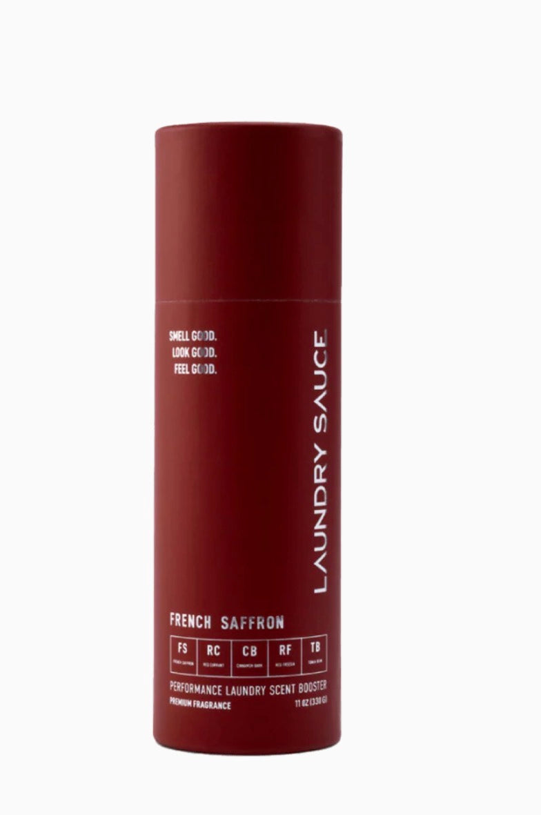 Maroon bottle of laundry sauce with white text on a white background
