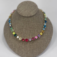 Multicolored beaded necklace on a brown jewelry display