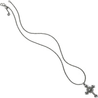 Silver cross necklace on a white background