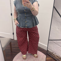 Women's maroon jeans with pink polka dot pattern