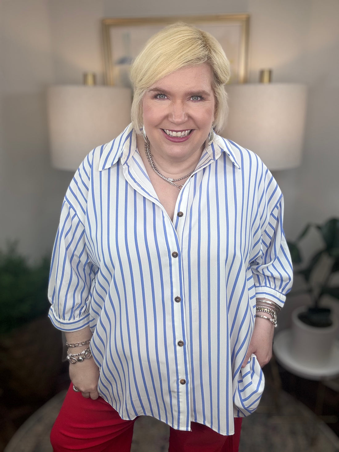 Woman wearing a blue and white striped top