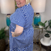 Woman wearing a blue and white checkered maxi dress.