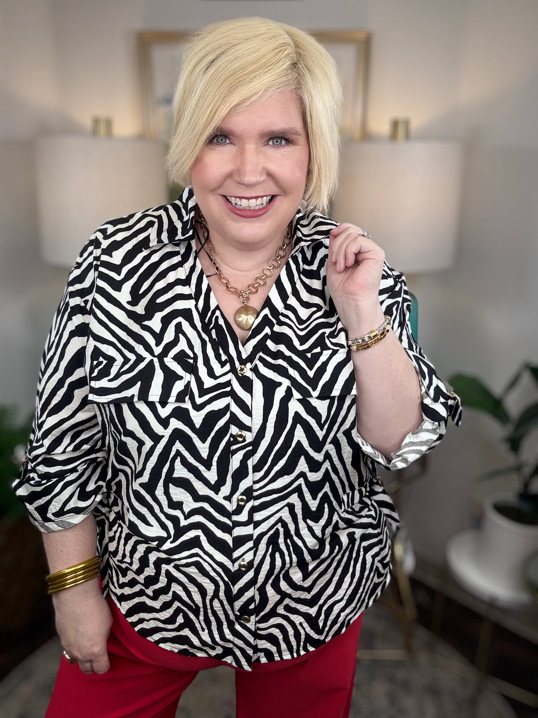 Women’s zebra print blouse with classic button-up design