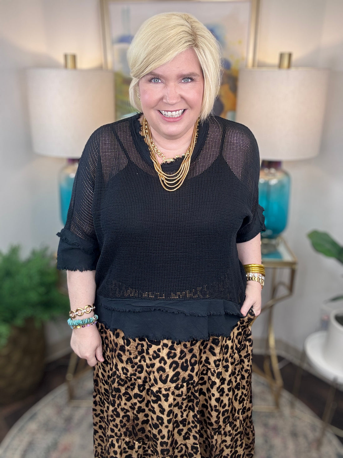 Woman wearing a black mesh top