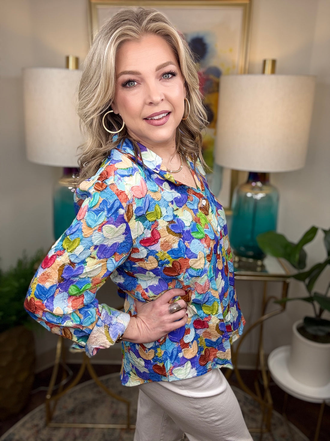 Woman wearing a colorful heart print blouse