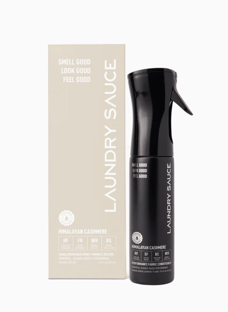 Black spray bottle labeled &