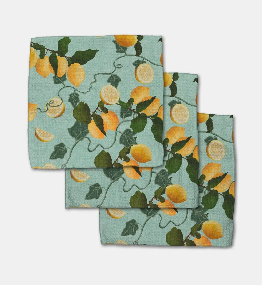 Set of three towels with lemon and vine pattern on a light blue background