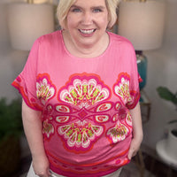 Woman wearing a pink floral top