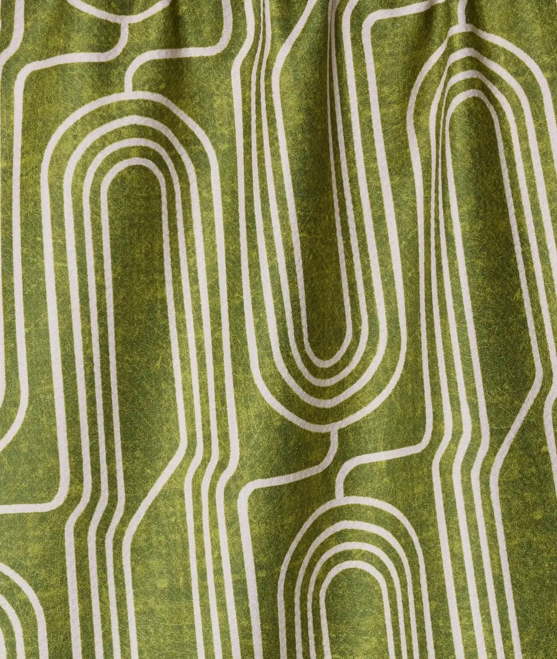 Close-up of green fabric with white geometric pattern