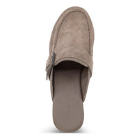 The Genni platform mule boasts a suede upper accented with aged-finish hardware and a loafer-inspired topline distinguish a retro suede mule