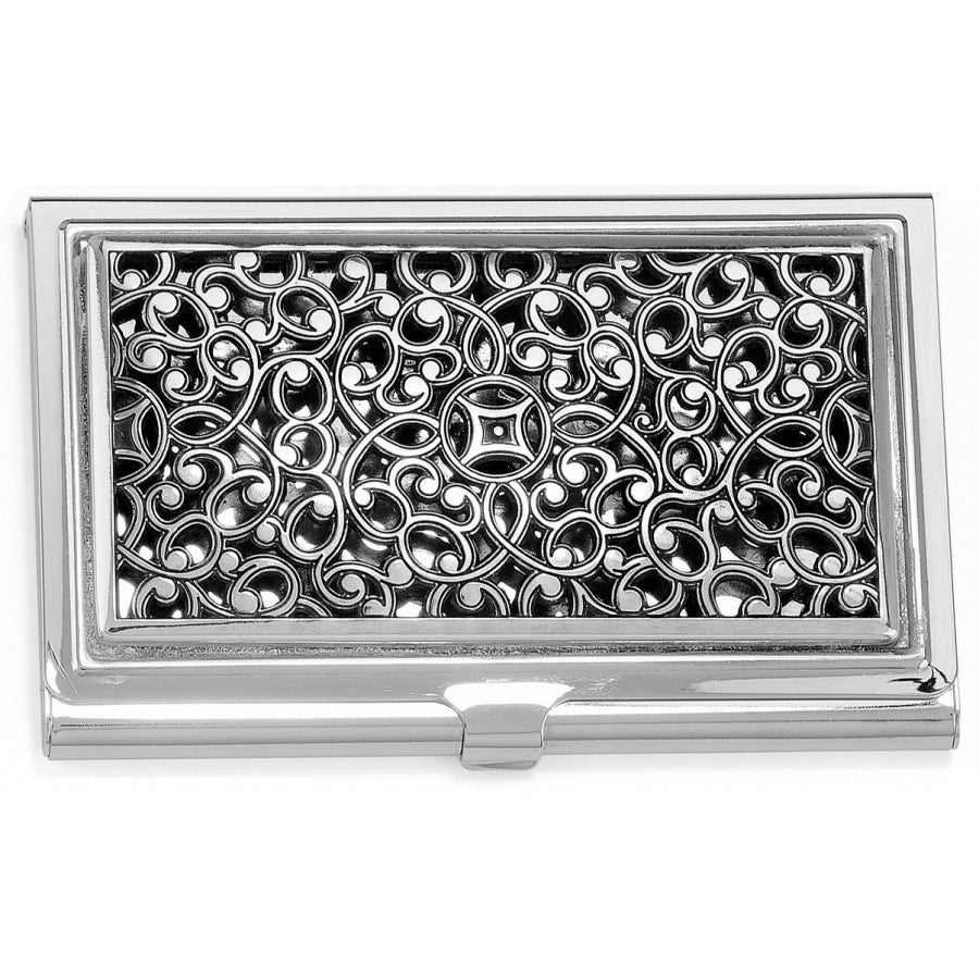Silver business card holder with intricate pattern on a white background