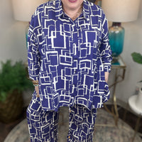 Woman wearing a blue and white geometric patterned shirt and pants