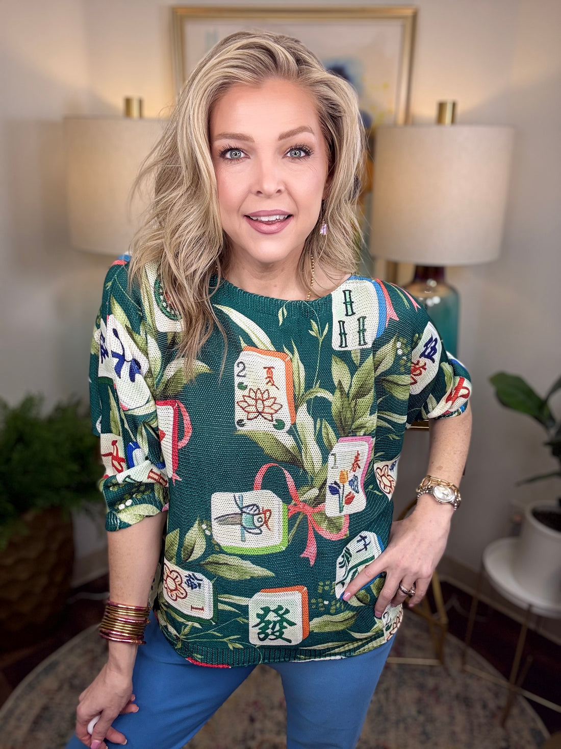 Green boatneck sweater with mahjong tile and greenery pattern