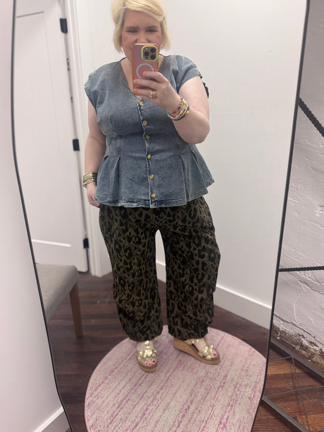 Dark olive green denim jogger pants with black leopard print
