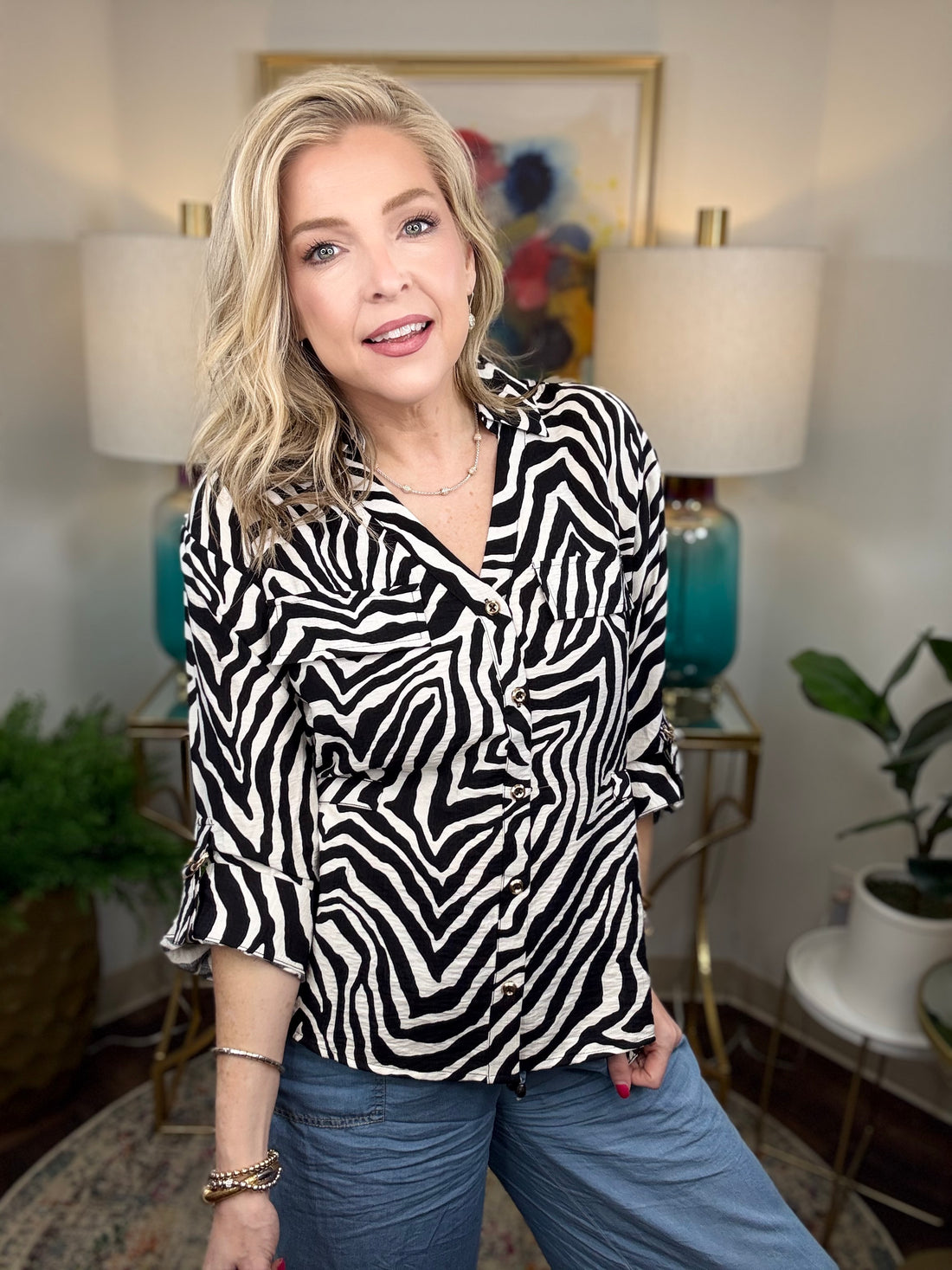 Women’s zebra print blouse with classic button-up design