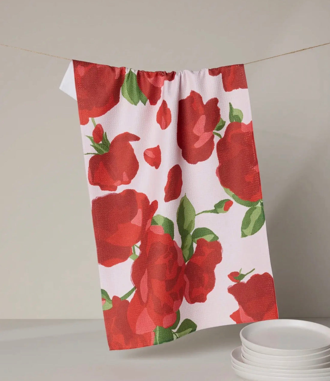 Towel with red rose pattern on a white background