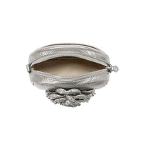 Silver clutch purse with decorative element on a white background