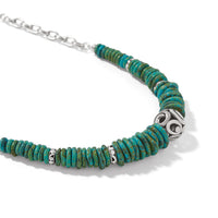 Necklace with turquoise beads and a silver focal bead