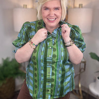 Women's patterned button-down top with ruffle details