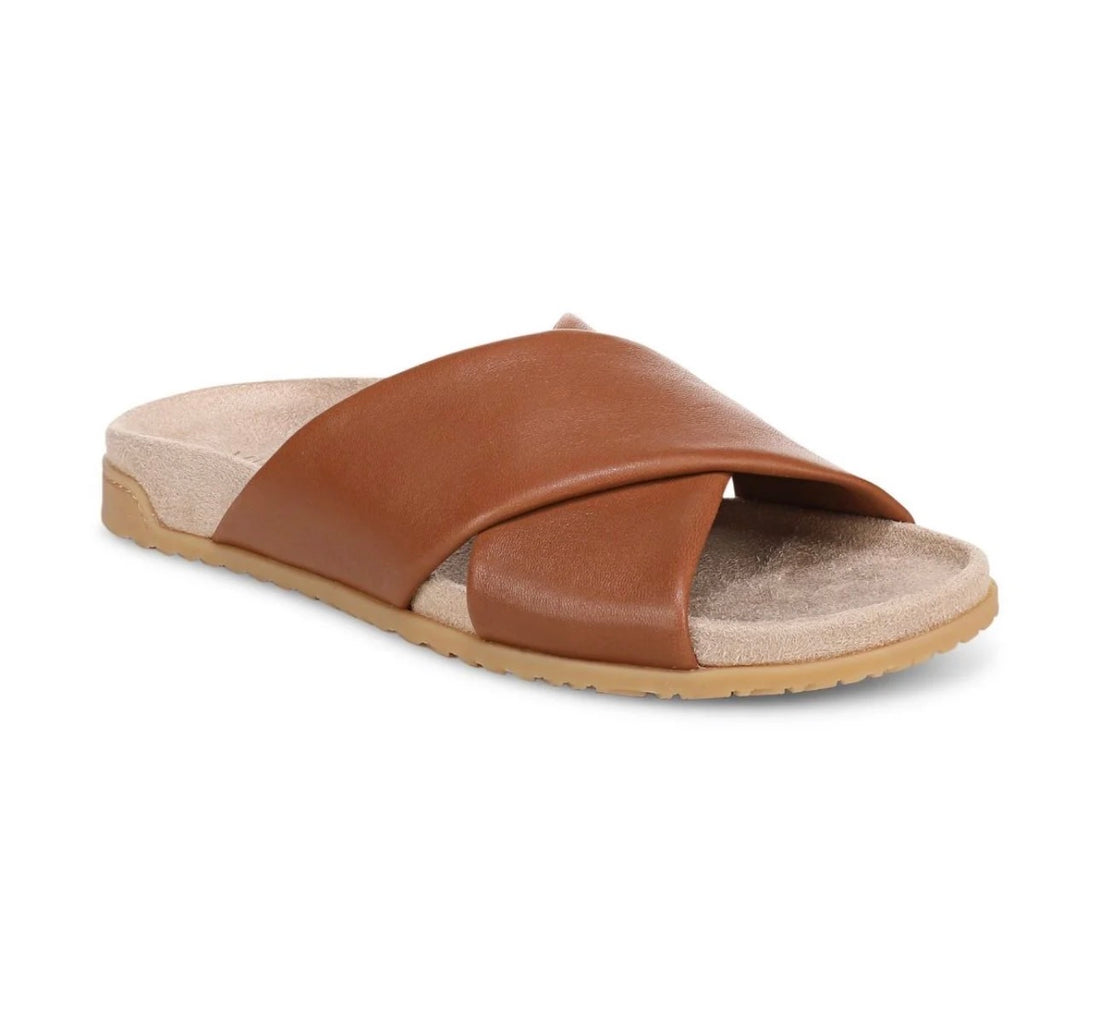 Brown sandal with a beige sole on a white background