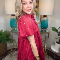 Women's faux suede button down dress available in black and crimson