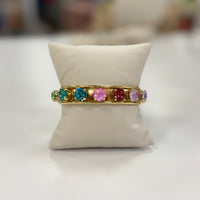 Gold cuff bracelet with multi-colored stones
