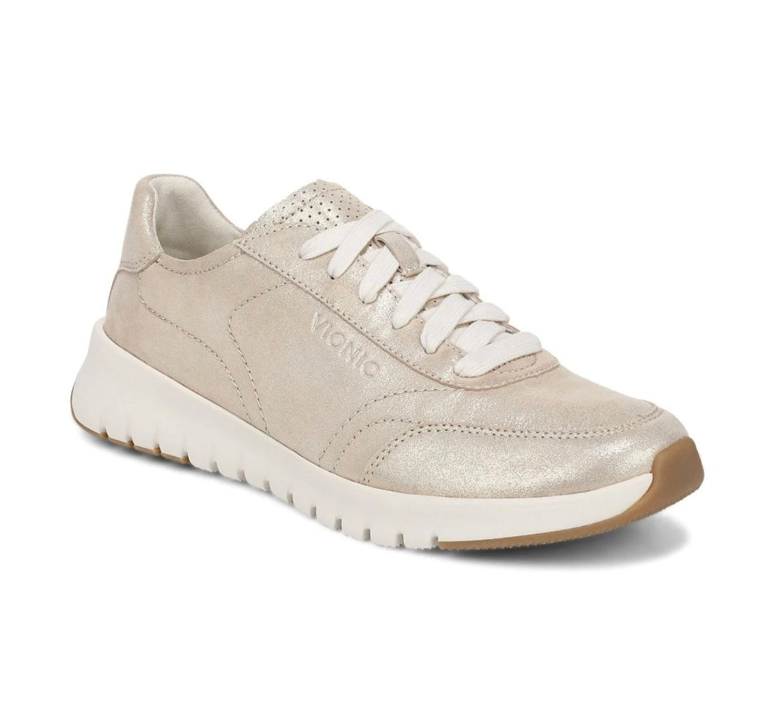 Metallic Beige sneaker with white laces on a white background