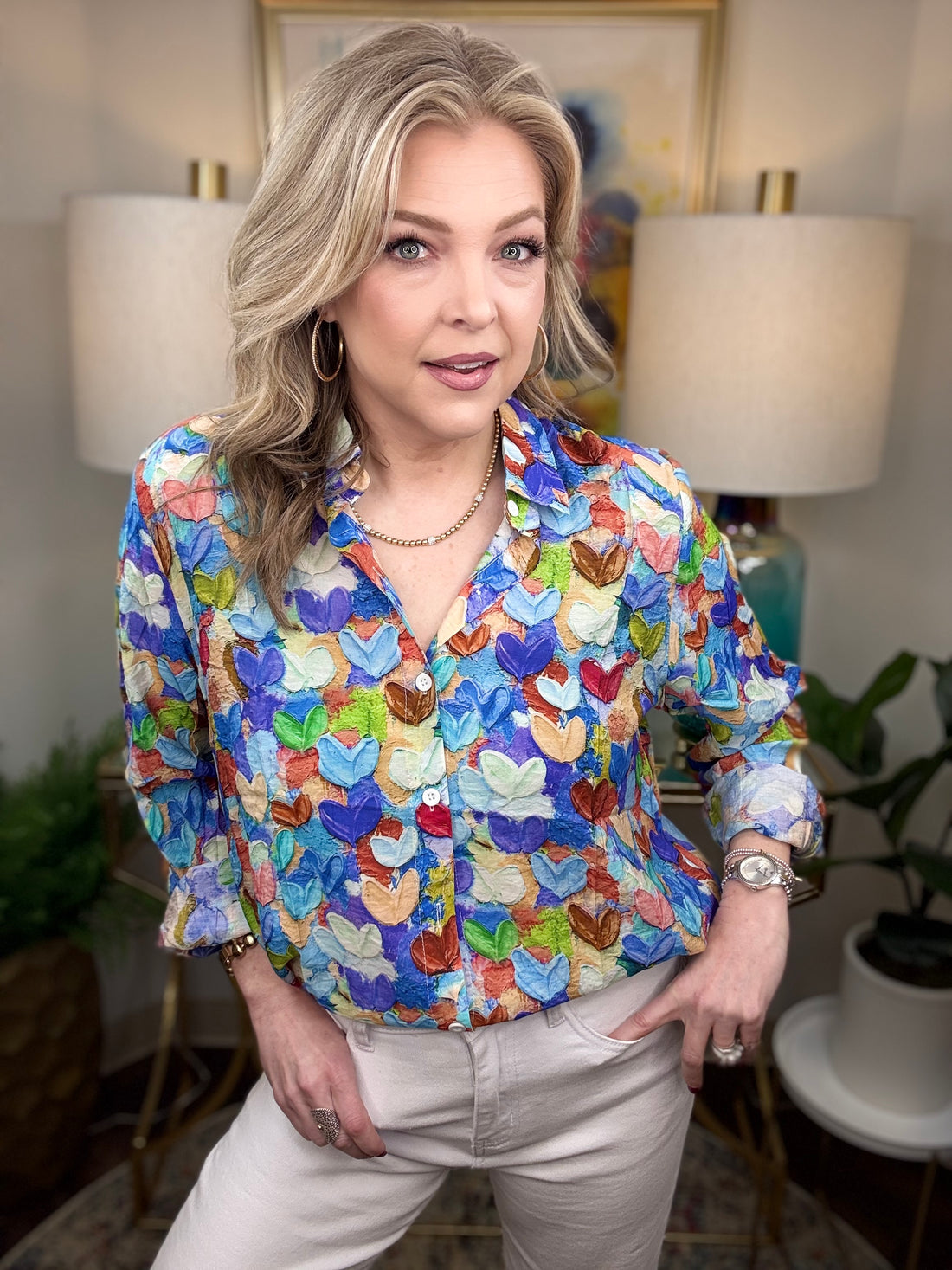 Woman wearing a colorful heart print blouse