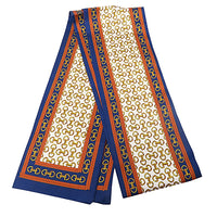 Navy, cream and rust colored twilly scarf with a gold horsebit pattern 