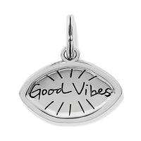 Silver pendant with 'Good Vibes' engraving on a white background