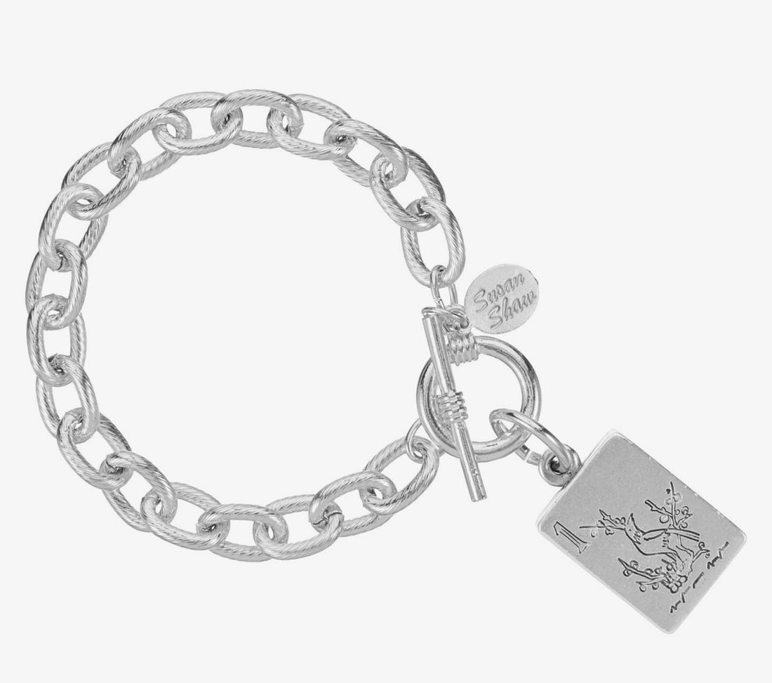 Silver Susan Shaw bracelet featuring a Bird Bam mahjong tile