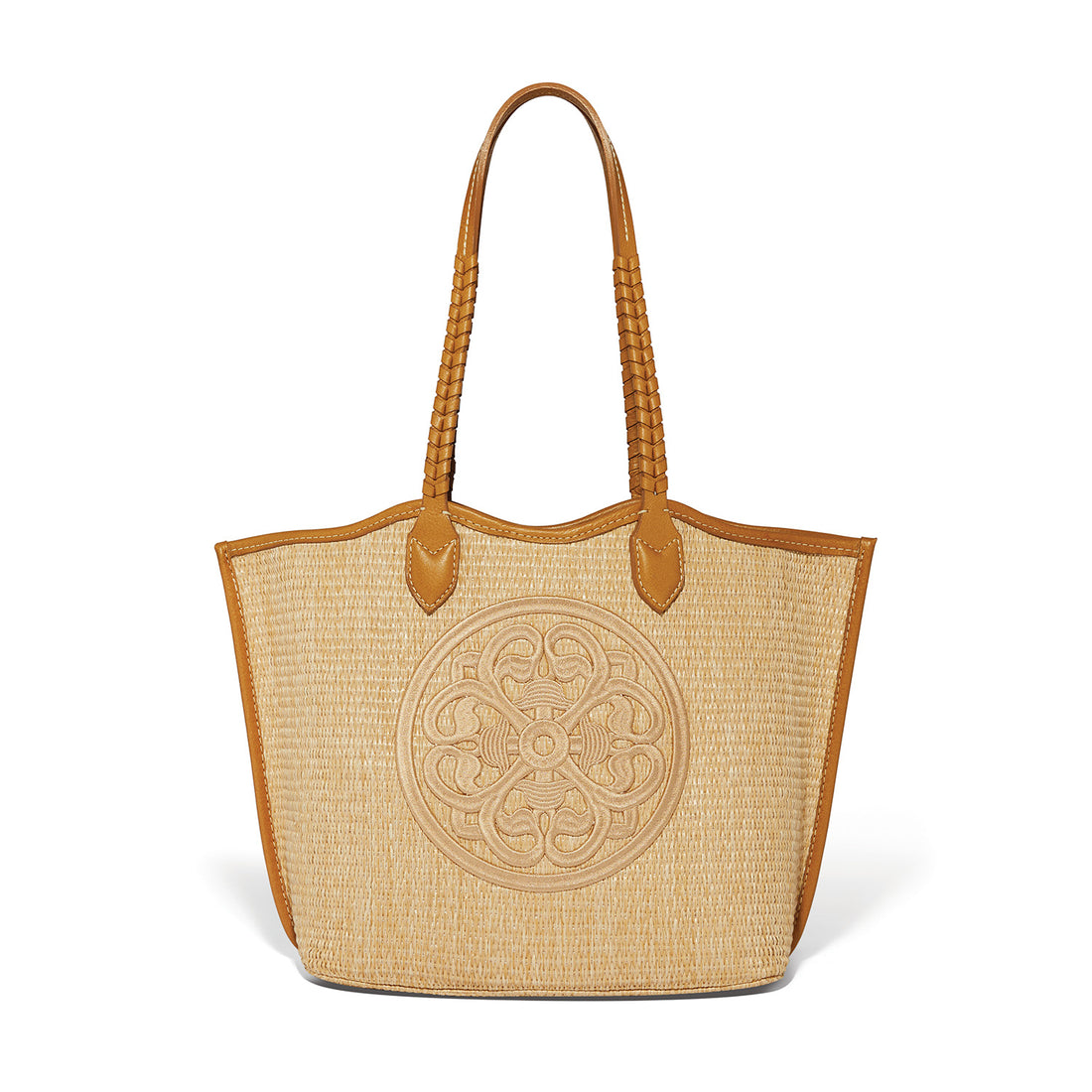 Woven tote bag with decorative emblem on a white background