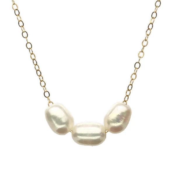 A necklace with three Freshwater Pearls custom drilled to slide over a gold chain. 