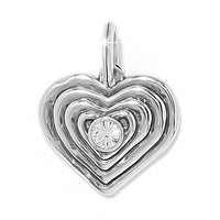 Silver heart-shaped pendant with a central gemstone on a white background