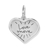 Silver heart-shaped pendant with 'love more' engraving on a white background