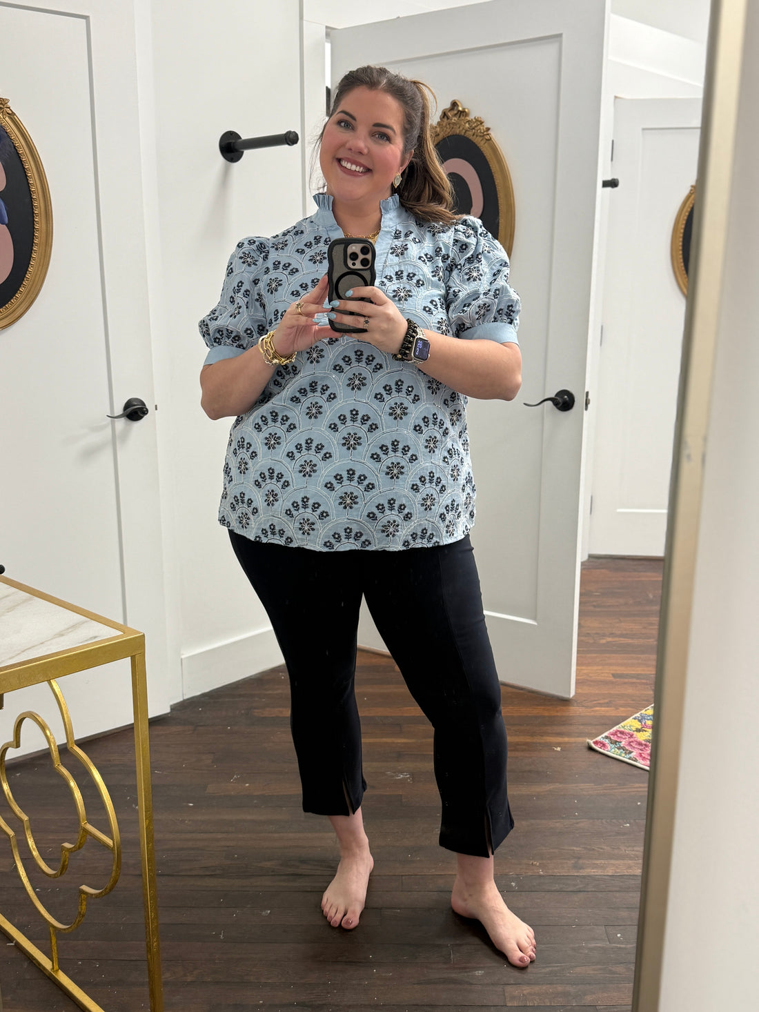 Navy blue pants with a front seam and subtle front slit detail. 