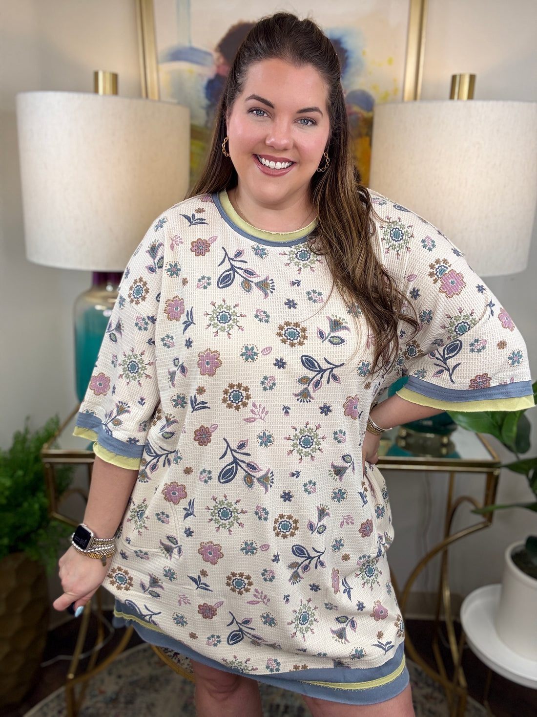 Woman in a floral waffle knit dress.