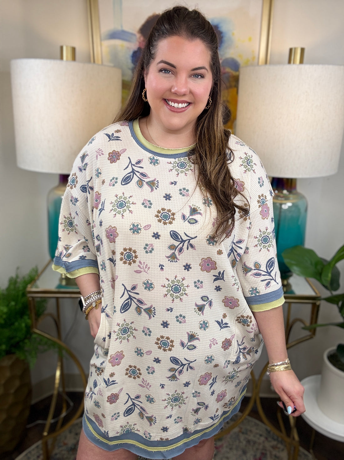 Woman in a floral waffle knit dress. 