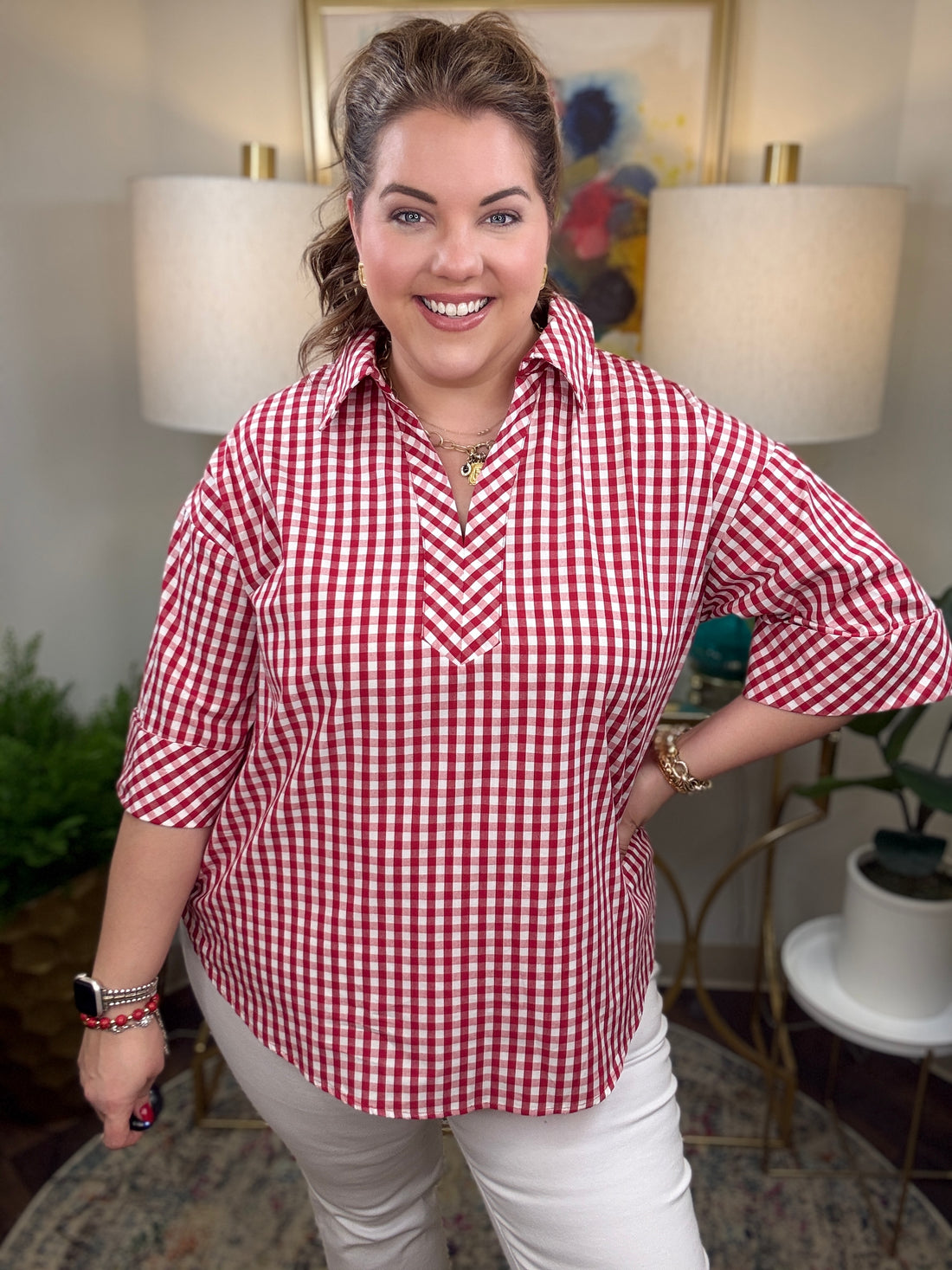 Woman wearing a red and white checkered shirt 