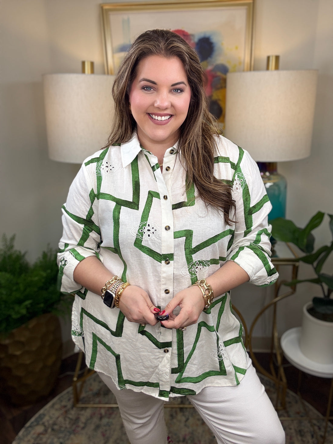 Woman wearing a white shirt with green zigzag pattern